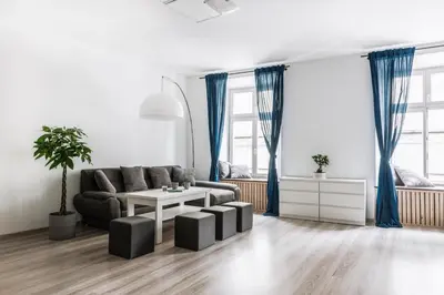 a living room with a couch and a table at Tomasza 20 Apartment 140m2 in Kraków