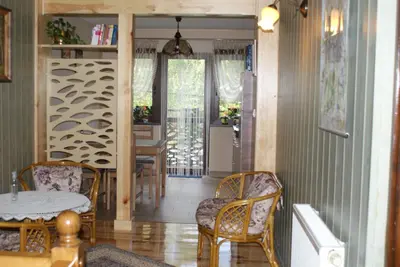 a dining room with a table and chairs at Agrogosia in Czajowice