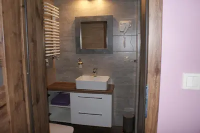 a bathroom with a sink and a mirror at Agrogosia in Czajowice