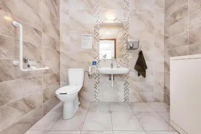a bathroom with a toilet and a sink at Dom Kolping in Kraków