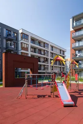 a playground with a slide in a city at Orange, modern apartment in the city centre in Kraków