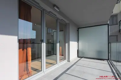 an empty corridor of a building with glass windows at Apartments Nearto Old Town Vermelo in Kraków