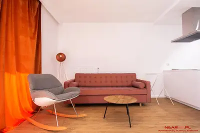 a living room with a couch and two chairs at Apartments Nearto Old Town Vermelo in Kraków