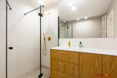 a bathroom with a sink and a shower at Apartments Nearto Old Town Vermelo in Kraków