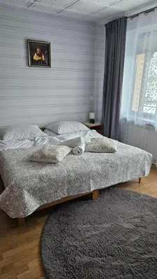 a bedroom with two beds and a picture on the wall at Agroturystyka U Misia in Niedźwiedź