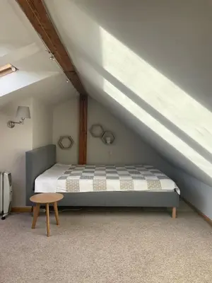a bedroom with a bed in a attic at OLSZA RESIDENCE Cozy & quiet 2 level apartment in Kraków