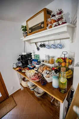 a shelf with food on it in a kitchen at Chata Pod Lasem in Poręba