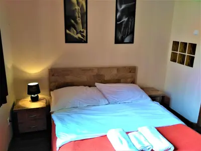 a bedroom with a bed with two towels on it at Akt Studio Apartment City Centre in Kraków