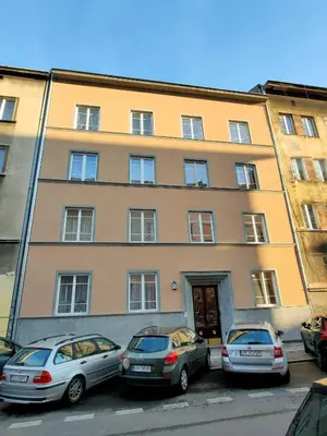 a building with cars parked in front of it at Akt Studio Apartment City Centre in Kraków