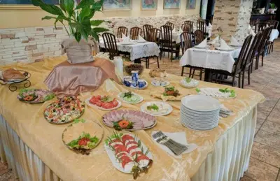 a table with plates of food on top of it at Hotel TERESITA in Kraków