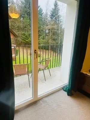 an open door with a view of a patio at Villa Vincentów in Myślenice