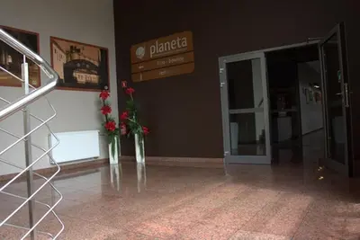 a lobby with two vases with flowers in it at QUEST HOTEL - dawniej Hotel Planeta in Brzesko