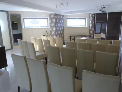 a room with a bunch of chairs and a table at QUEST HOTEL - dawniej Hotel Planeta in Brzesko