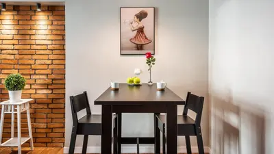 a dining room with a table and chairs at Flaminio Smart Sleep in Kraków