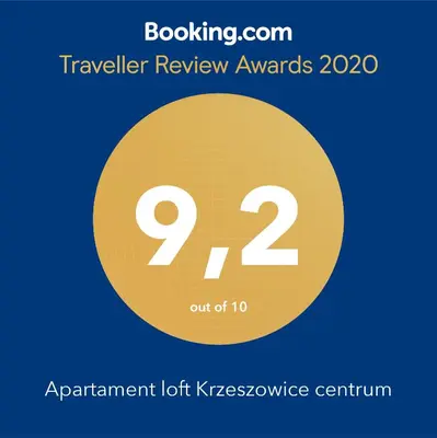 a sign that reads travel review awards with a yellow circle at Apartament loft Krzeszowice centrum in Krzeszowice
