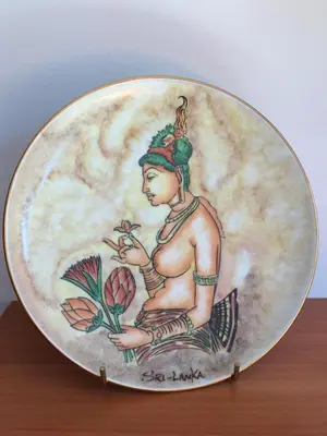a plate with a woman holding a flower at do parku zdrojowego 1 krok in Rabka