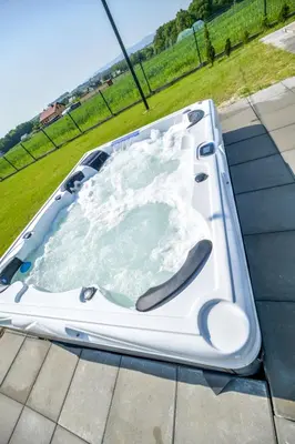a jacuzzi tub on the roof of a house at Słoneczne Wzgórze Zator in Zator