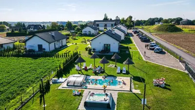 an aerial view of a house with a swimming pool at Słoneczne Wzgórze Zator in Zator