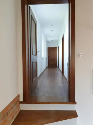 an empty hallway with a mirror and a door at Pokoje u Jasia i Małgosi in Skawa