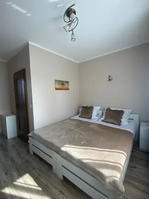a bedroom with a bed in a white room at Pokoje u Jasia i Małgosi in Skawa