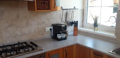 a kitchen with a counter top with a coffee maker at Dom w Beskidach in Stryszawa