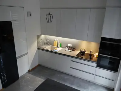 a kitchen with a counter with a sink and a microwave at Beautiful City Centre Apartament in Kraków
