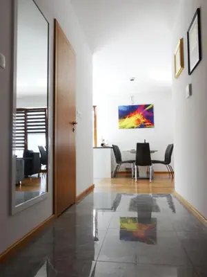 a living room with a table and chairs at Beautiful City Centre Apartament in Kraków