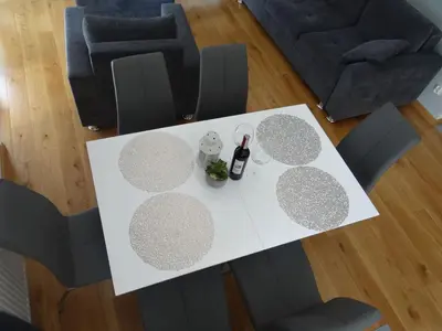 an overhead view of a white table and chairs at Beautiful City Centre Apartament in Kraków