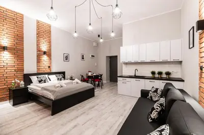 a large bedroom with a bed and a kitchen at Dietla 32 Residence - ideal location in the heart of Krakow, between Main Square and Kazimierz District in Kraków