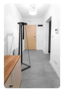 an empty room with a hallway with a door at Room Tour Rakowicka 14a in Kraków