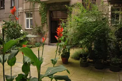 a courtyard with a bunch of plants and flowers at Art Pop in Cracow in Kraków