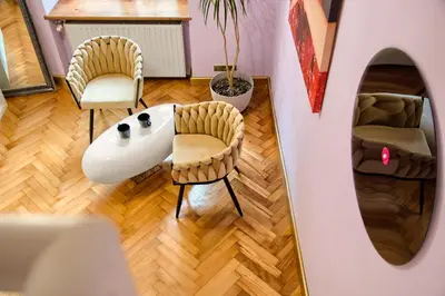 a living room with two chairs and a table at Art Pop in Cracow in Kraków