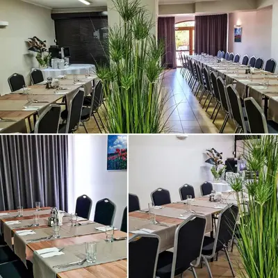 a row of tables and chairs in a room at Hotel Łokietek in Czajowice