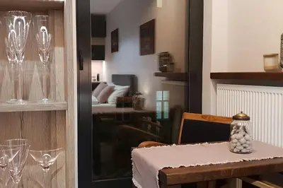 a dining room with a table with wine glasses at BOUTIQUE 108 - old city, luxury apt. with a garage in Kraków