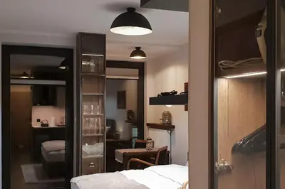 a bedroom with a bed and a room with a mirror at BOUTIQUE 108 - old city, luxury apt. with a garage in Kraków