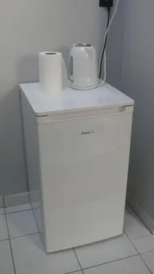 a white refrigerator with two toilets on top of it at Dom Gościnny Wisteria in Andrychów