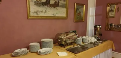 a table with plates and dishes on top of it at Dom Gościnny Wisteria in Andrychów
