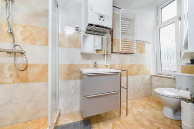 a bedroom with a large bed and a couch at Beautiful Apartment on Main Square / Old Town / City Center in Kraków
