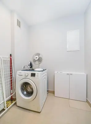 a washer and dryer in a room at Deluxe Apartments Kraków Brzozowa by Noclegi Renters in Kraków