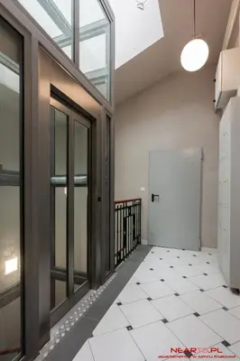 a kitchen with a table and a dining room at Premium Apartment Old Town Topolowa in Kraków