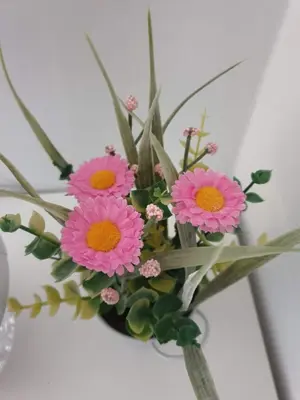 a bouquet of pink flowers in a vase at ap4you Tauron Cracow in Kraków