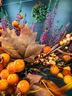 a bunch of leaves and fruit on a table at Hotel Victoria in Olkusz