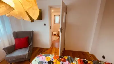 a room with a couch and a chair and a door at Domek przy Rajskiej in Jerzmanowice