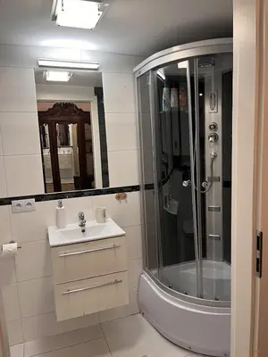 a bathroom with a shower and a sink at Charming studio apartment in the heart of the Jewish District! in Kraków