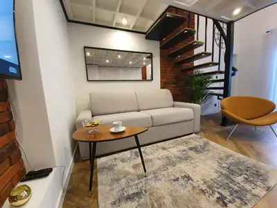 a living room with a couch and a table at Old Town Apartment, Morsztynowska in Kraków