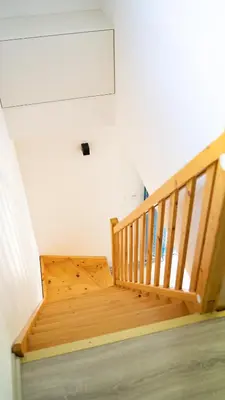 a wooden stair case in a room with at Domek POD GOLCOWEM in Limanowa