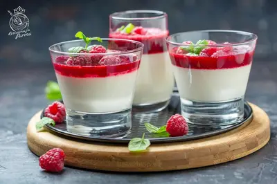 two glasses of water with raspberries on a wooden tray at Villa Królewiec - 1,5km od Energylandii in Zator