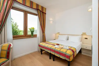a hotel room with a bed and a window at Villa Królewiec - 1,5km od Energylandii in Zator