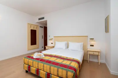 a bedroom with a bed and two nightstands and a bed sidx sidx sidx at Villa Królewiec - 1,5km od Energylandii in Zator