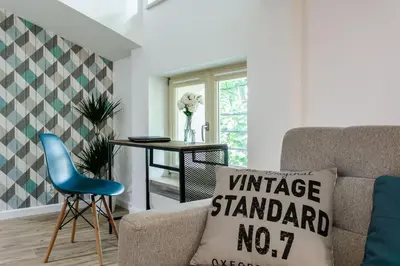 a living room with a couch and a table at MY KRAKOW Apartments - Topolowa 8 in Kraków